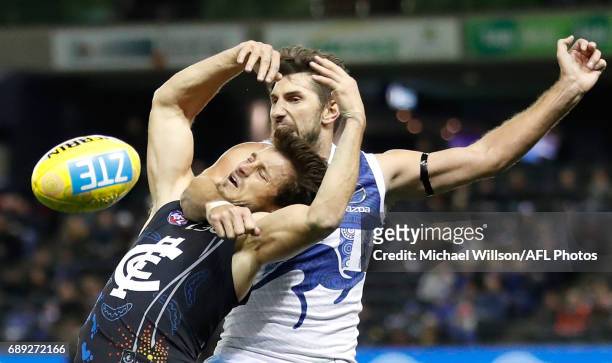 Alex Silvagni of the Blues is taken high by Jarrad Waite of the Kangaroos during the 2017 AFL round 10 match between the Carlton Blues and the North...
