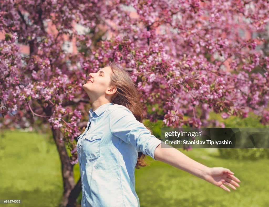 Young girl in an apple orchard.