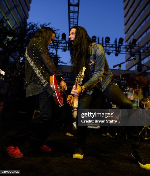 Guitarist Brent Muscat and musician Todd Kerns of the band Original Sin perform during the "Rock the Street" Memorial Day weekend block party on...