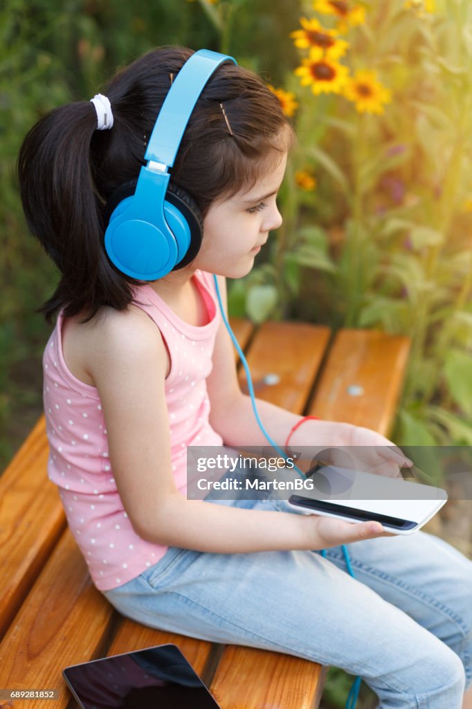 Girl Listening To Music With Headphones