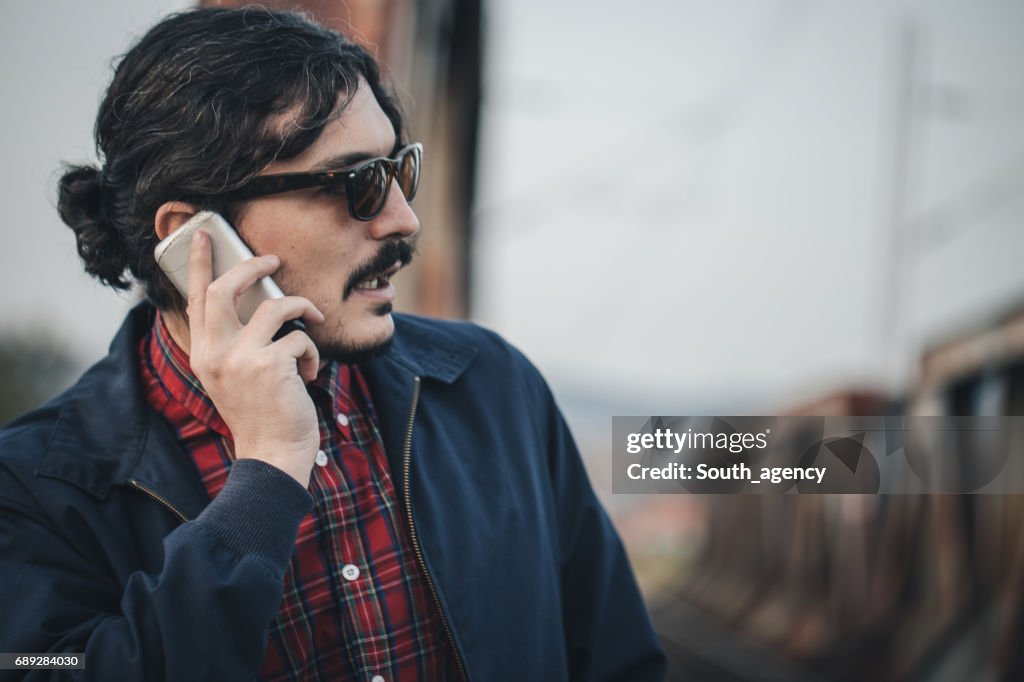 Hipster with a mobile phone