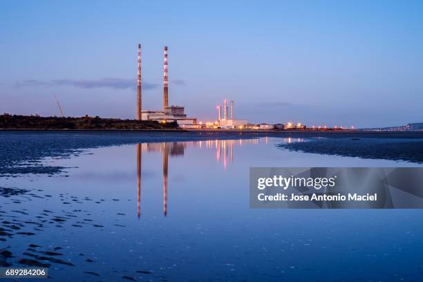 poolbeg chimneys - maciel stock pictures, royalty-free photos & images