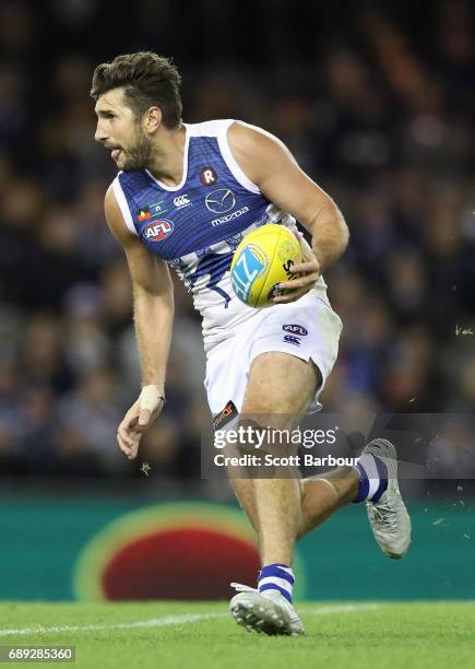 Jarrad Waite of the Kangaroos runs with the ball during the round 10 AFL match between the Carlton Blues and the North Melbourne Kangaroos at Etihad...