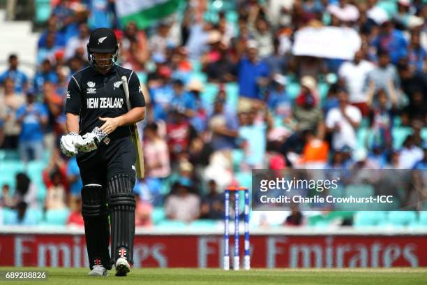Neil Broom of New Zealand walks off dejected having been bowled off by Mohammed Shami of India for a golden duck during the ICC Champions Trophy...