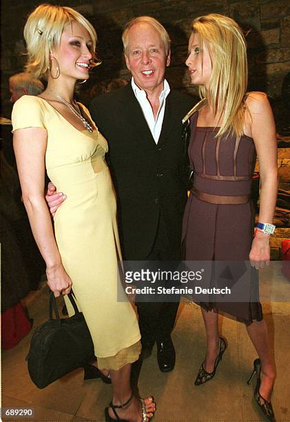 Socialites Paris and Nicky Hilton join Caribou Club owner Harley Baldwin at the Prada grand opening December 29 in Aspen, CO.