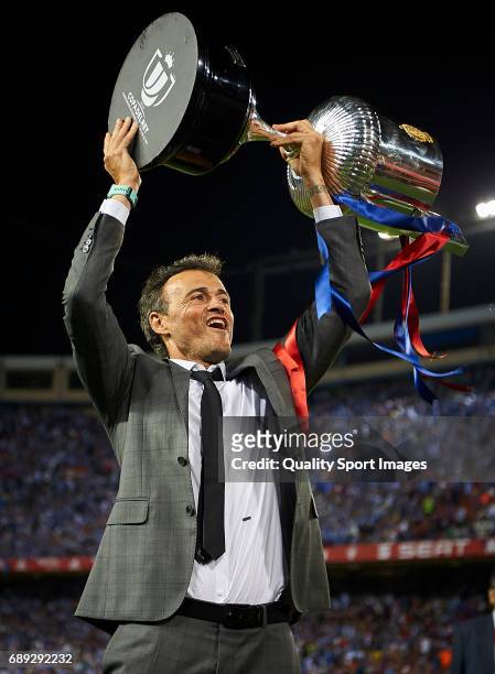 Luis Enrique, Manager of FC Barcelona celebrates with the trophy after winning the Copa Del Rey Final match between FC Barcelona and Deportivo Alaves...