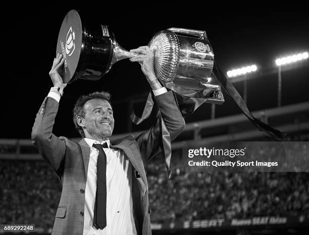 Luis Enrique, Manager of FC Barcelona celebrates with the trophy after winning the Copa Del Rey Final match between FC Barcelona and Deportivo Alaves...