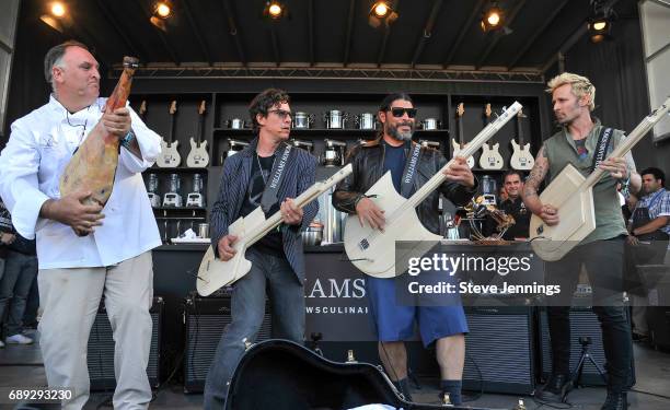 Chef Jose Andres plays around with bass players Stefan Lessard of Dave Matthews Band, Robert Trujillo of Metallica and Mike Dirnt of Green Day at the...