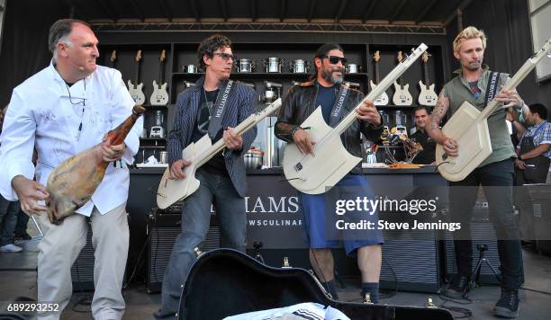 Chef Jose Andres plays around with bass players Stefan Lessard of Dave Matthews Band, Robert Trujillo of Metallica and Mike Dirnt of Green Day at the...