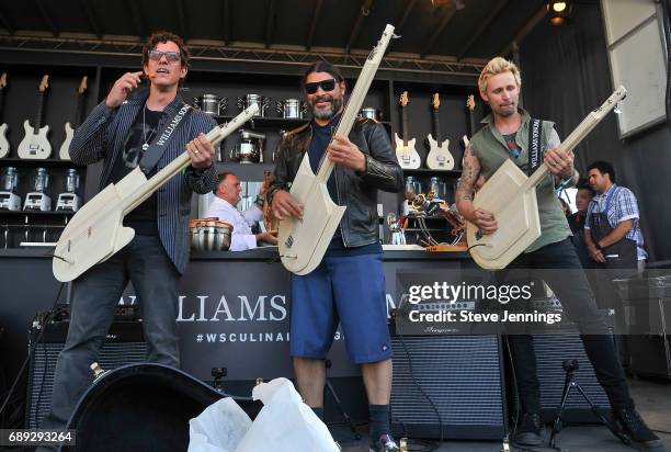 Bass players Stefan Lessard of Dave Matthews Band, Robert Trujillo of Metallica and Mike Dirnt of Green Day perform at the William Sonoma Culinary...