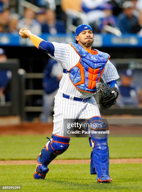 Catcher Rene Rivera of the New York Mets throws out Jarred Cosart at first base after fielding a bunt by Cosart in the third inning in an MLB...