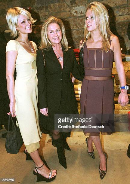 Socialites Paris and Nicky Hilton join their mother Kathy for the grand opening of Prada December 29, 2001 in Aspen, CO.