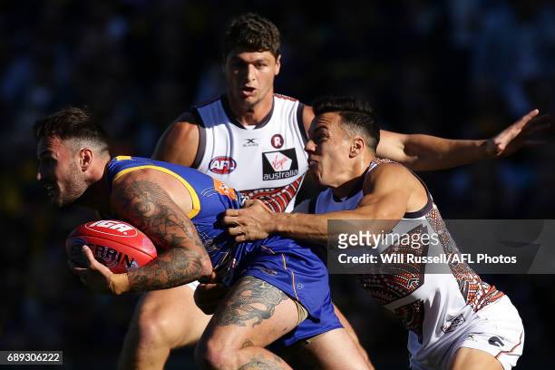 Chris Masten of the Eagles is tackled by Dylan Shiel of the Giants during the round 10 AFL match between the West Coast Eagles and the Greater...