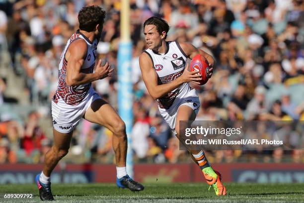 Josh Kelly of the Giants looks to pass the ball during the round 10 AFL match between the West Coast Eagles and the Greater Western Giants at Domain...