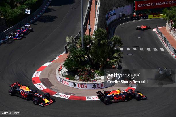 Daniel Ricciardo of Australia driving the Red Bull Racing Red Bull-TAG Heuer RB13 TAG Heuer and Max Verstappen of the Netherlands driving the Red...