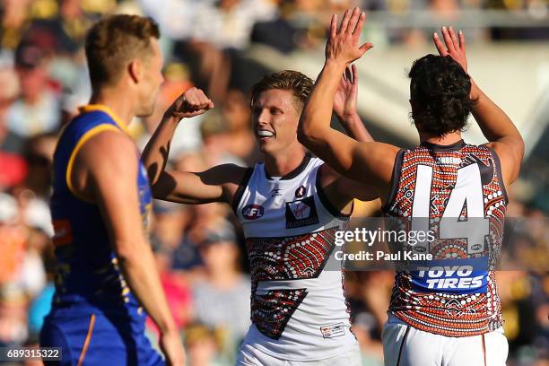 Lachie Whitfield of the Giants celebrates a goal during the round 10 AFL match between the West Coast Eagles and the Greater Western Giants at Domain...