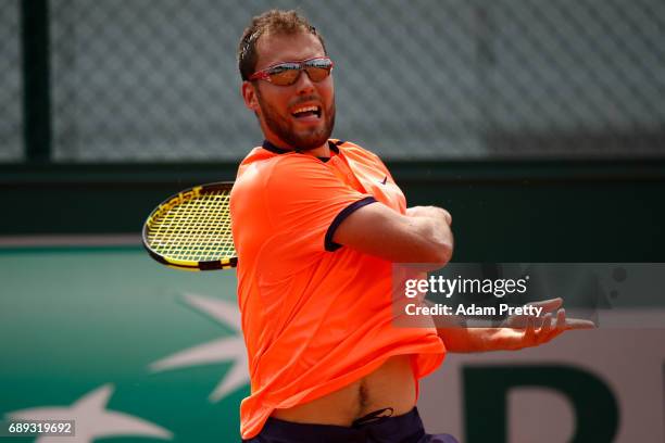 Jerzy Janowicz of Poland hits a forehand during the mens singles first round match against Taro Daniel of Japan on day one of the 2017 French Open at...