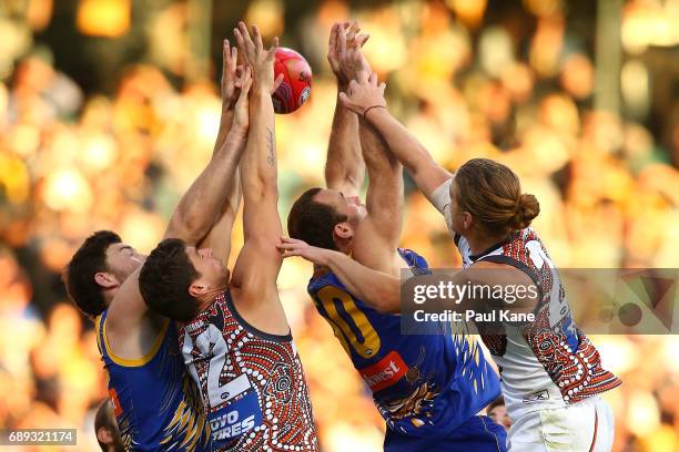 Jeremy McGovern and Shannon Hurn of the Eagles contest a mark against Jonathon Patton and Harrison Himmelberg of the Giants during the round 10 AFL...