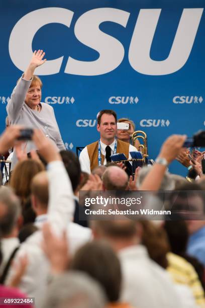 German Chancellor and Chairwoman of the German Christian Democrats Angela Merkel waves to supporters at the Trudering fest on May 28, 2017 in Munich,...