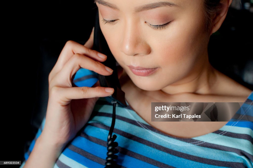 Woman using a telephone