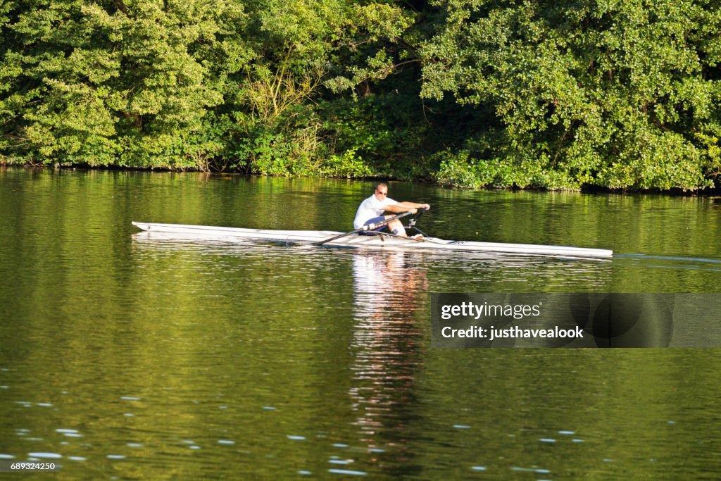 Man doing sport rowing on Ruhr