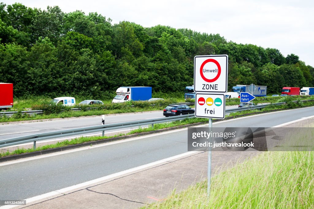 Traffic jam on highway and CO2 road sign