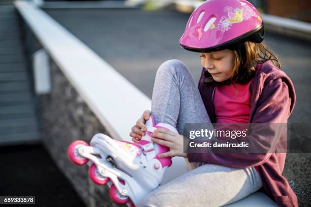 beautiful girl with roller skates - girl roller skates stock pictures, royalty-free photos & images