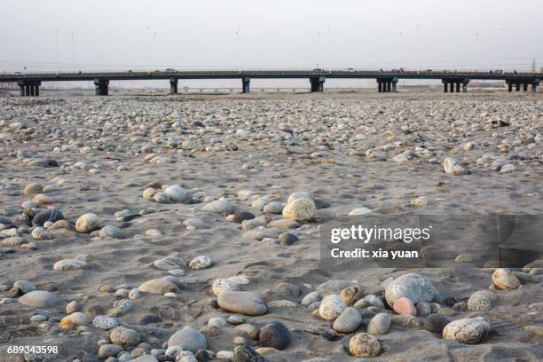 stones on the riverbed of yurungkash river,hotan,china - jade yuan stockfoto's en -beelden