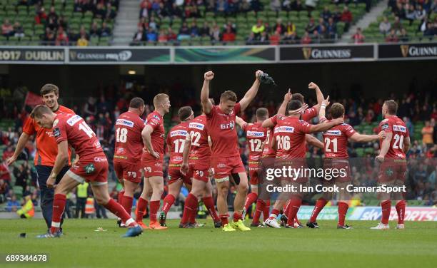 Scarlets' Jonathan Davies and his team-mates celebrate at the final whistle during the Guinness PRO12 Final match between Munster and Scarlets at the...