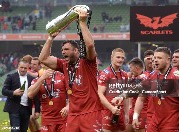 Scarlets' Tadhg Beirne celebrates with the Guinness Pro12 Trophy during the Guinness PRO12 Final match between Munster and Scarlets at the Aviva...