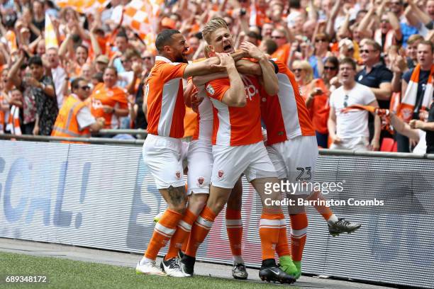 Brad Potts of Blackpool celebrates scoring his sides first goal with his Blackpool team mates during the Sky Bet League Two Playoff Final between...