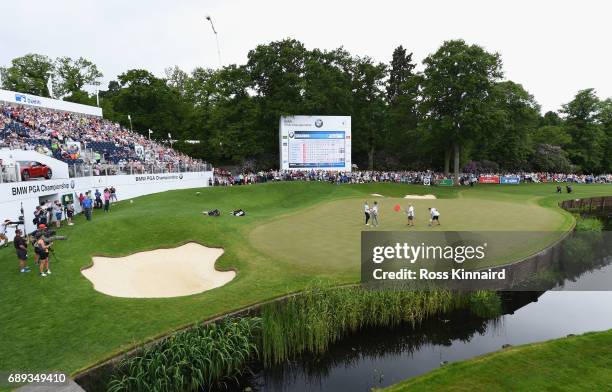 Alex Noren of Sweden shakes hands with Peter Uihlein of the United States on the 18th green during day four of the BMW PGA Championship at Wentworth...