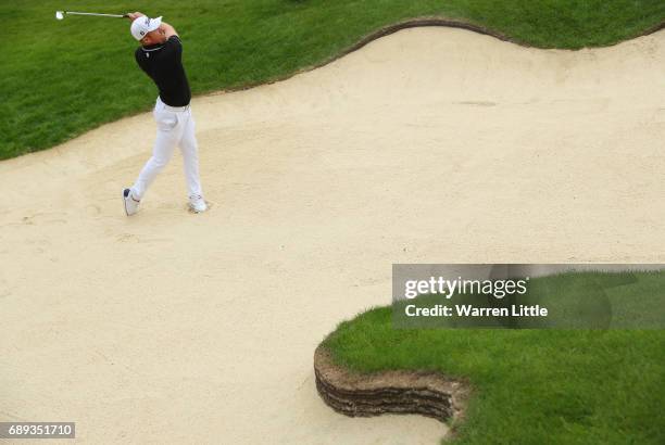 Andrew Dodt of Australia plays his second shot on the 11th hole during the final round on day four of the BMW PGA Championship at Wentworth on May...