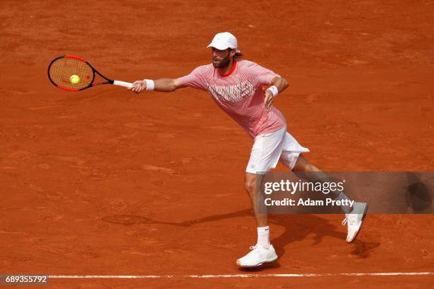 Stephane Robert of France plays a forehand during the mens singles first round match against Grigor Dimitrov of Bulgaria on day one of the 2017...