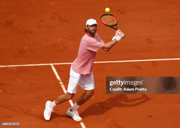 Stephane Robert of France plays a backhand during the mens singles first round match against Grigor Dimitrov of Bulgaria on day one of the 2017...