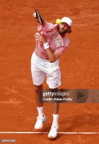 Stephane Robert of France serves during the mens singles first round match against Grigor Dimitrov of Bulgaria on day one of the 2017 French Open at...