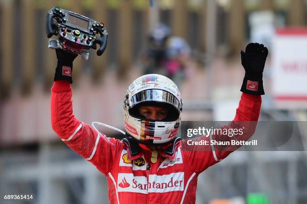 Race winner Sebastian Vettel of Germany and Ferrari celebrates in parc ferme during the Monaco Formula One Grand Prix at Circuit de Monaco on May 28,...
