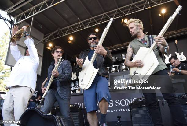 Chef Jose Andres, Stefan Lessard of Dave Matthews Band, Robert Trujillo of Metallica, and Mike Dirnt of Green Day participate at the Culinary stage...