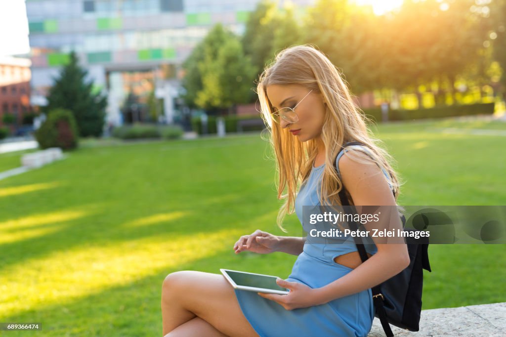 Young woman using digital tablet