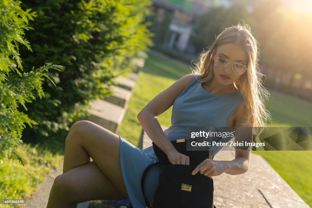 Young woman sitting in a park