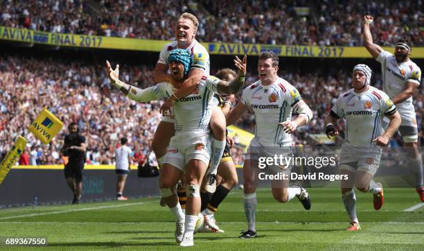 Jack Nowell of Exeter Chiefs celerbates with team mate Stuart Townsend during the Aviva Premiership match between Wasps and Exeter Chiefs at...