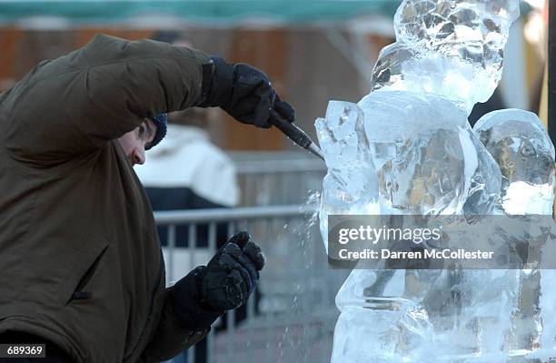 Master ice sculptor, Eric Fontecchio, works on a ice sculpture to be displayed during First Night celebrations December 31, 2001 in Boston,...