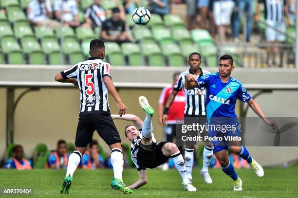 Adilson of Atletico MG and Ravanelli of Ponte Preta battle for the ball during a match between Atletico MG and Ponte Preta as part of Brasileirao...