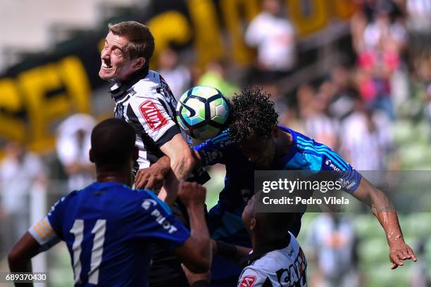 Adilson of Atletico MG and Elton of Ponte Preta battle for the ball during a match between Atletico MG and Ponte Preta as part of Brasileirao Series...