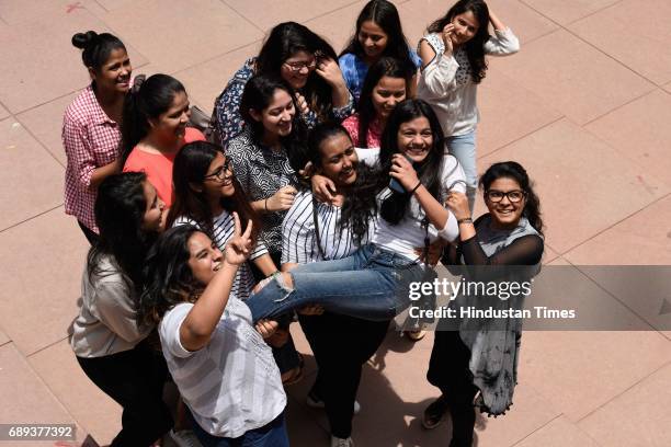 Students of St Thomas School celebrate after the CBSE class 12th results 2017 announced at their school, on May 28, 2017 in New Delhi, India. A total...