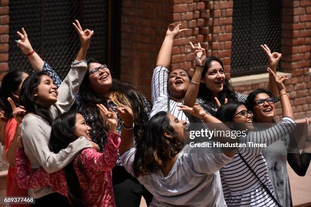 Students of St Thomas School celebrate after the CBSE class 12th results 2017 announced at their school, on May 28, 2017 in New Delhi, India. A total...