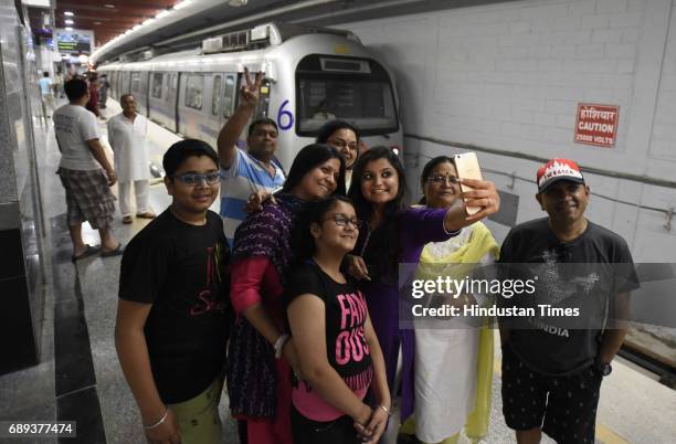 People enjoying first metro ride at ITO to Kashmere Gate section, after Union Minister of Urban Development M. Venkaiah Naidu, and Chief Minister of...