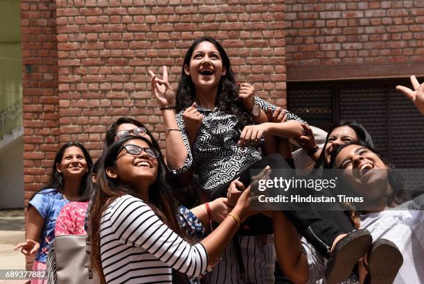 Students of St Thomas School celebrate after the CBSE class 12th results 2017 announced at their school, on May 28, 2017 in New Delhi, India. A total...