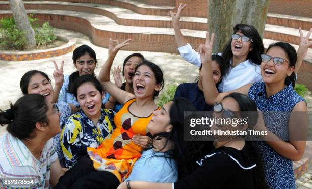 Students celebrate after the CBSE class 12th results 2017 announced at Blue Bells Model School sector-4, on May 28, 2017 in Gurugram, India. A total...