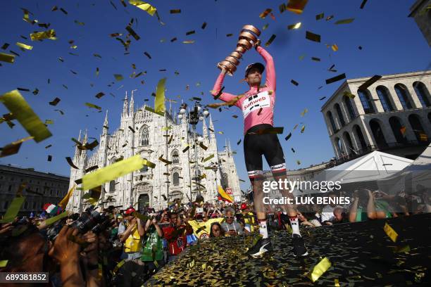 The winner of the 100th Giro d'Italia, Tour of Italy cycling race, Netherlands' Tom Dumoulin of team Sunweb holds the trophy on the podium near...